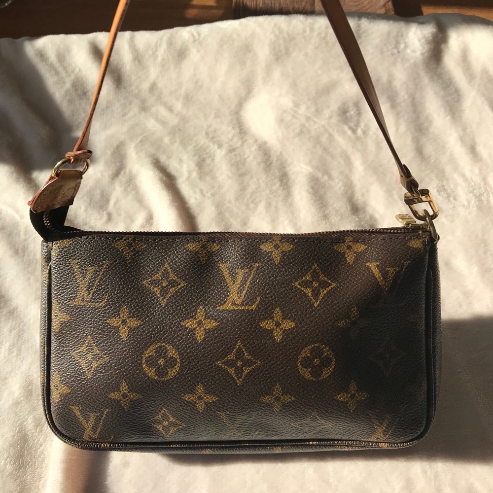 Louis Vuitton wristlet.